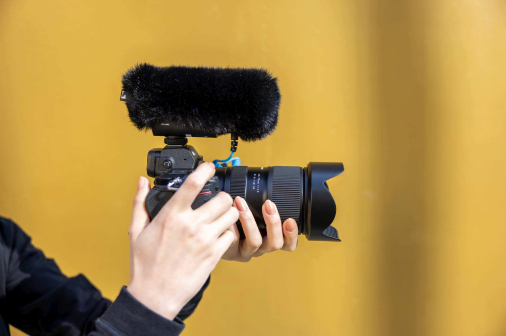 Tamron camera with microphone setup Camera with microphone for professional videography and photography.