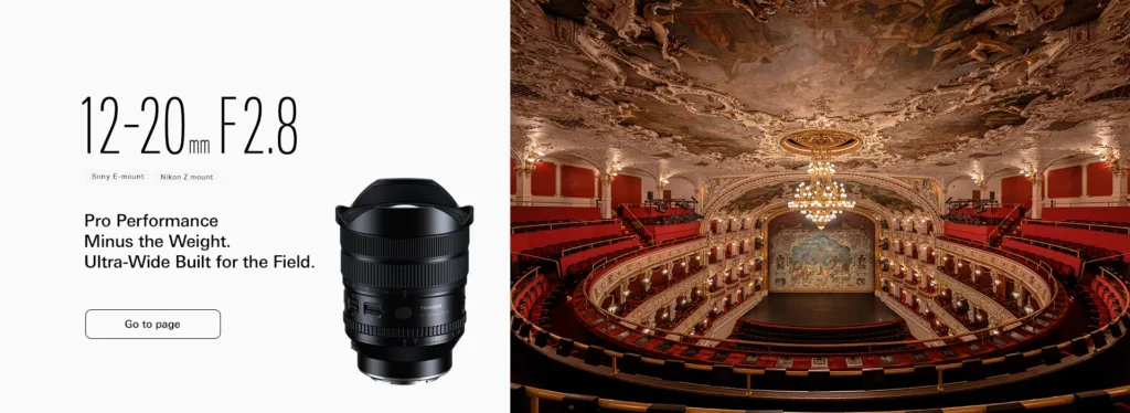 Tamron lens capturing theatre interior with ornate ceiling and red seats.